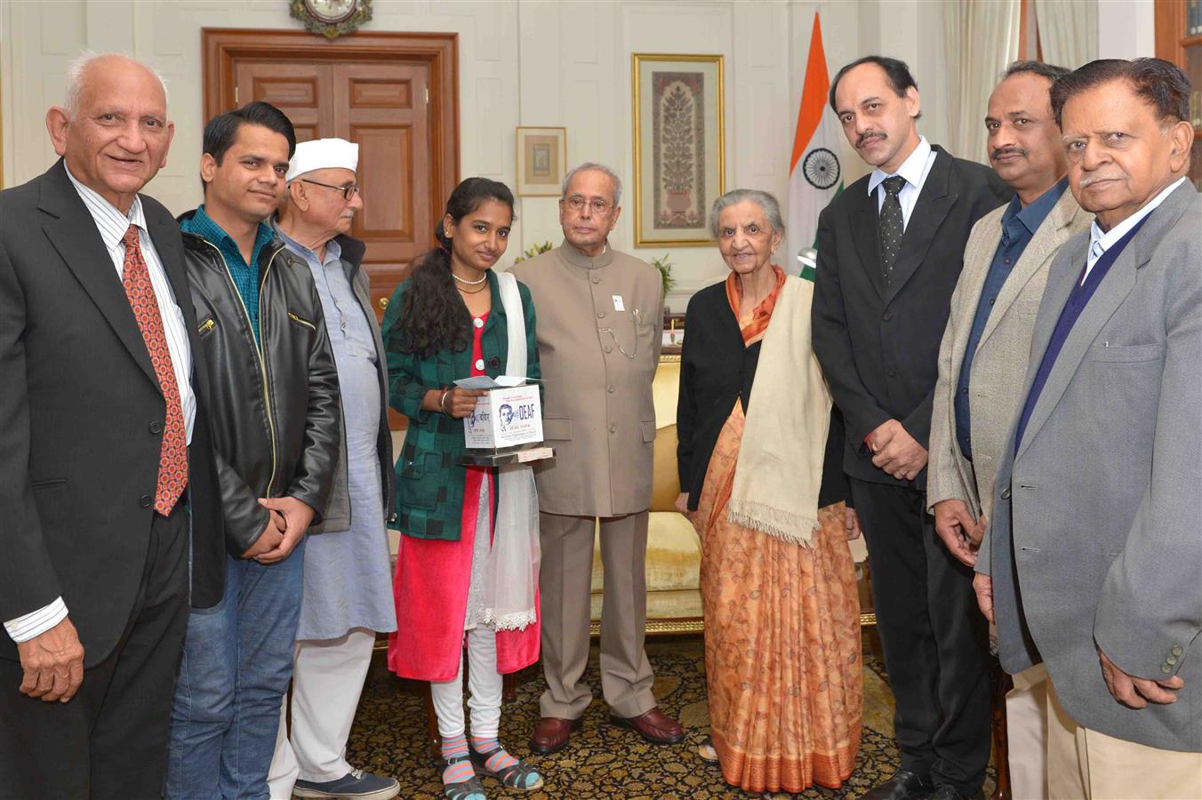 Kumari Surendar Saini, President of the 'All Federation of the Deaf' placing Flag Sticker on the President of India, Shri Pranab Mukherjee at Rashtrapati Bhavan on February 1, 2017 on the occasion of their Flag Day.