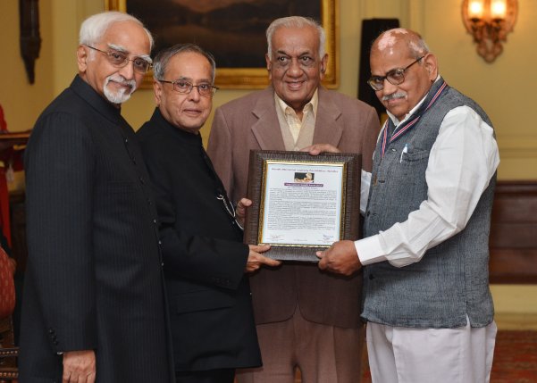 The President of India, Shri Pranab Mukherjee presenting International Gandhi Award for the year 2013 to Dr. Vijaykumar Vinayak Dongre for making outstanding contribution in the field of leprosy at Rashtrapati Bhavan in New Delhi February 15, 2014. Also s 