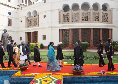 The President of India, Shri Pranab Mukherjee walking in procession towards the Central Hall of Parliament in New Delhi on February 21, 2013 to deliver his address to both the Houses of Parliament. Also seen (left to right) are the Prime Minister of Indi