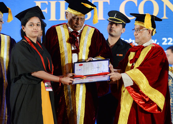 The President of India, Shri Pranab Mukherjee while presenting a degree to the student at the Convocation of Indian Maritime University at Chennai Trade Centre at Chennai in Tamil Nadu onFebruary 22, 2014. Also seen is the Governor of Tamil Nadu, Shri K. 