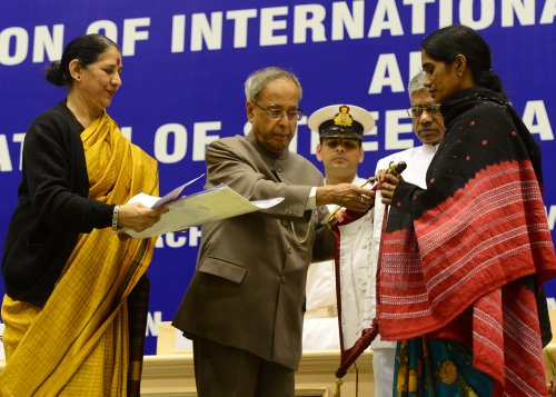 The President of India, Shri Pranab Mukherjee while Presenting the Stree Shakti Puruskar for the Year 2012 on the occassion of International Women's Day at Vigyan Bhawan in New Delhi on March 8, 2013. Also seen is the Union Minister of State (Independent