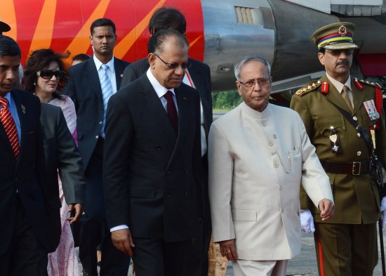 The President of India, Shri Pranab Mukherjee being received by the Prime Minister of Republic of Mauritius, Dr. Navinchandra Ramgoolam, GCSK, FRCP on his arrival at Port Louis airport in Mauritius on March 11, 2013 at the start of his State Visit.