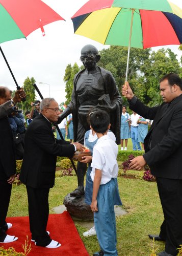 The President of India, Shri Pranab Mukherjee paying floral tributes on the statue Mahatma Gandhi at Mahatma Gandhi Institute at Port Louis in Mauritius on March 13, 2013.