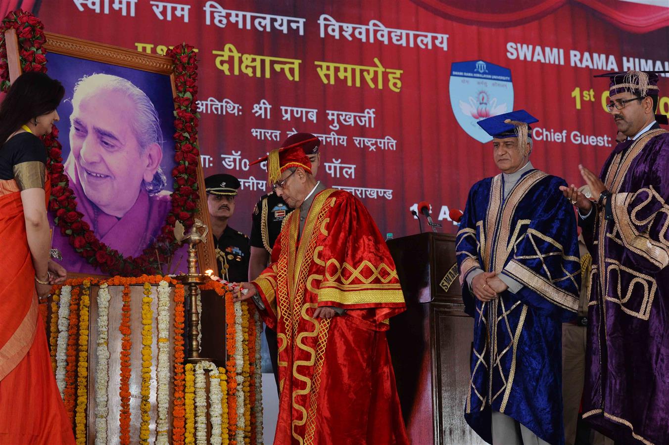 The President of India, Shri Pranab Mukherjee lighting the lamp at the first convocation of Swami Rama Himalayan University at Dehradun on April 1, 2016. 