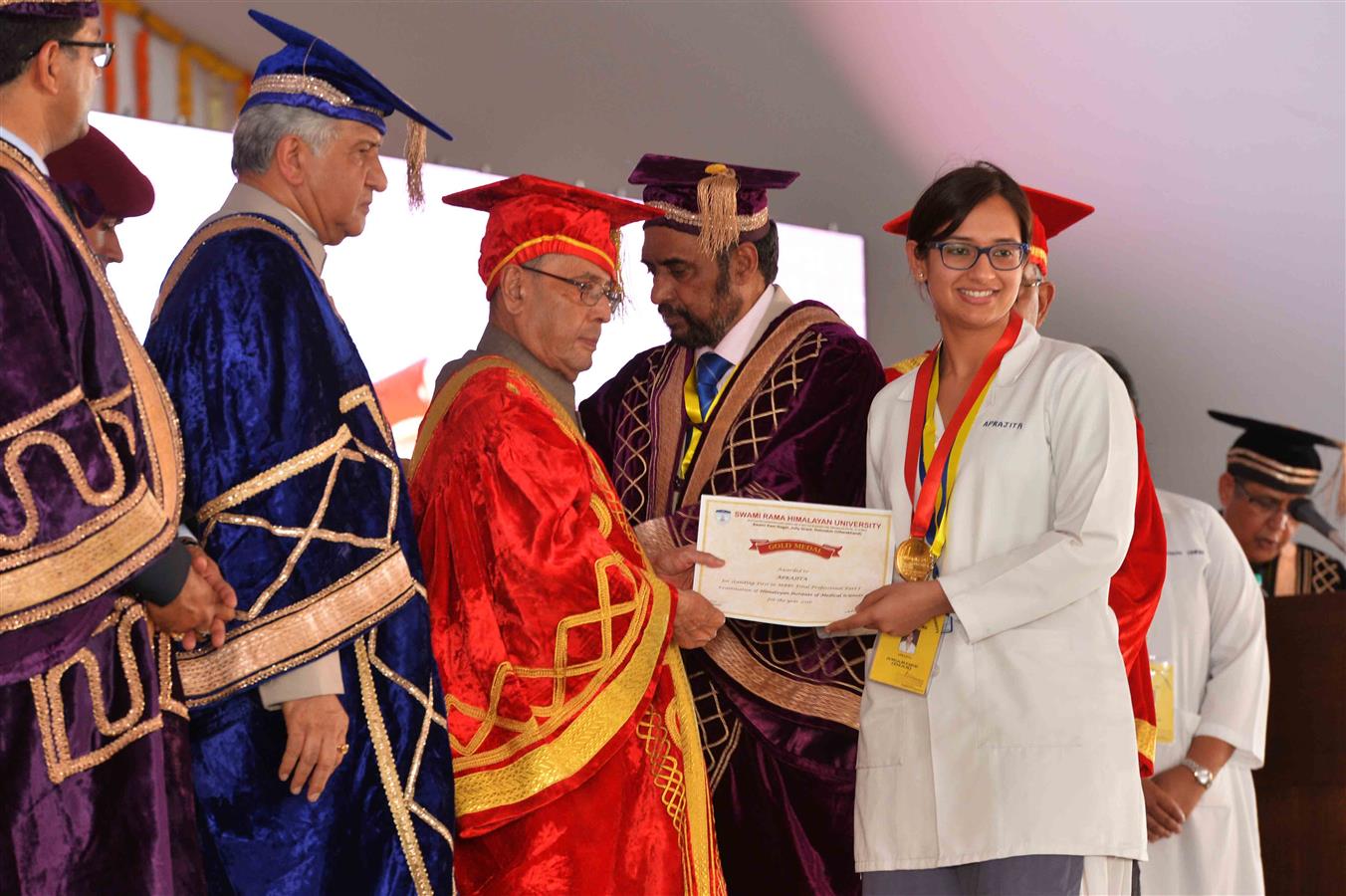 The President of India, Shri Pranab Mukherjee presenting a degree certificate to the Student at the first convocation of Swami Rama Himalayan University at Dehradun on April 1, 2016. 