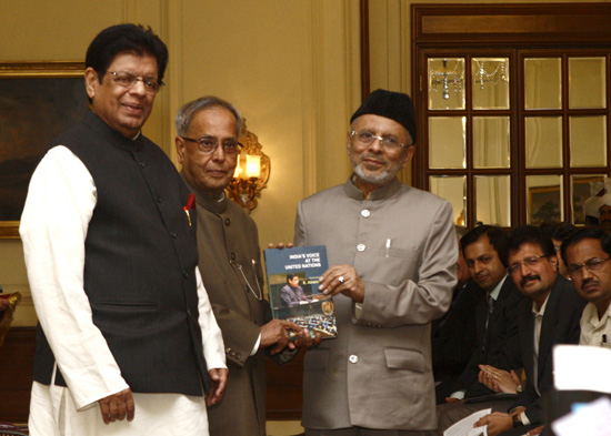 The President of India, Shri Pranab Mukherjee receiving a copy of book 'India's Voice at the United Nations - Speeches by E. Ahamed' at Rashtrapati Bhavan in New Delhi on March 14, 2013. Also seen is the Union Minister of State for External Affairs, Shri