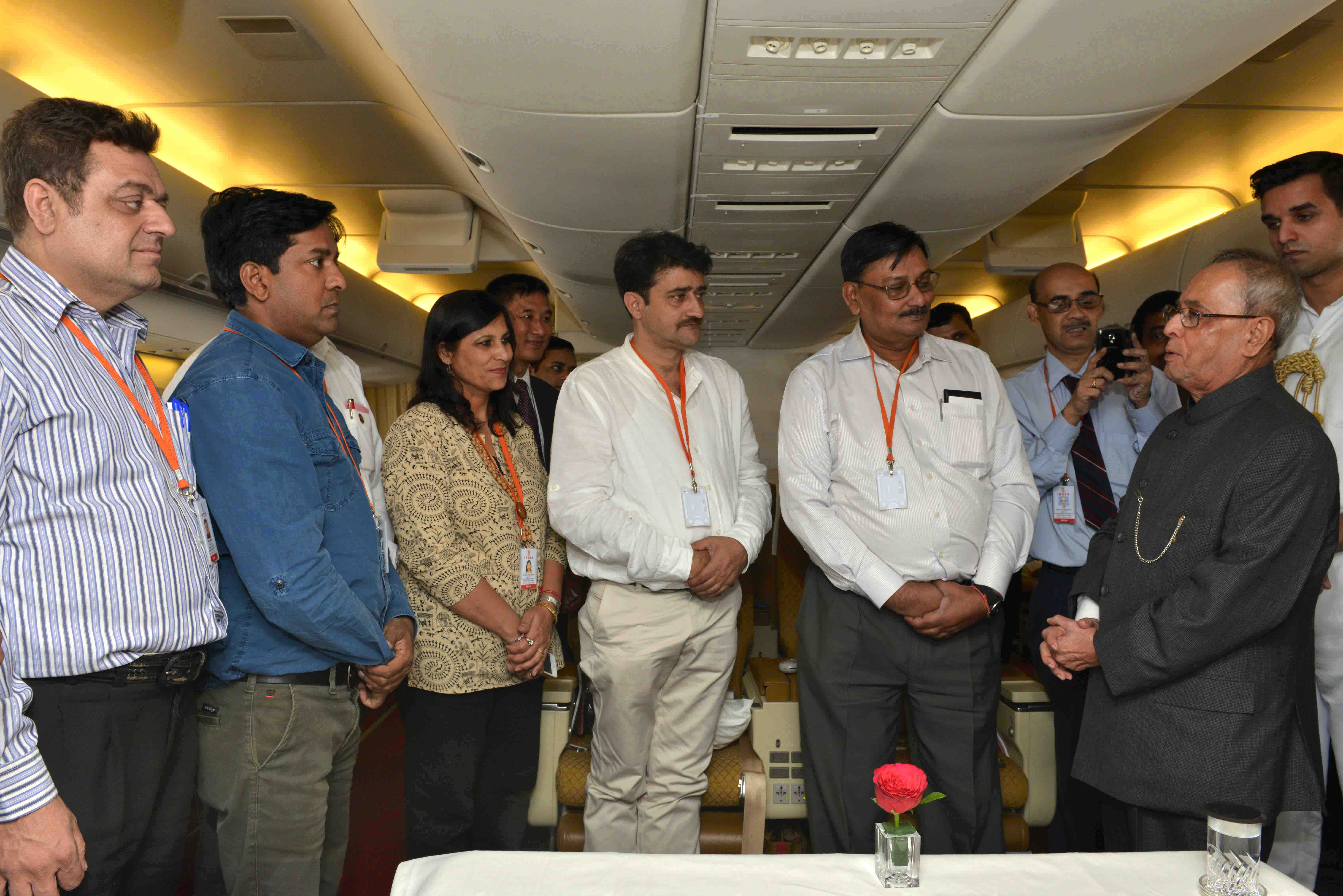 The President of India, Shri Pranab Mukherjee meeting with the official and accompanying delegates during his visit at Sweden and Belarus at Air India Special Aircraft on May 31, 2015.