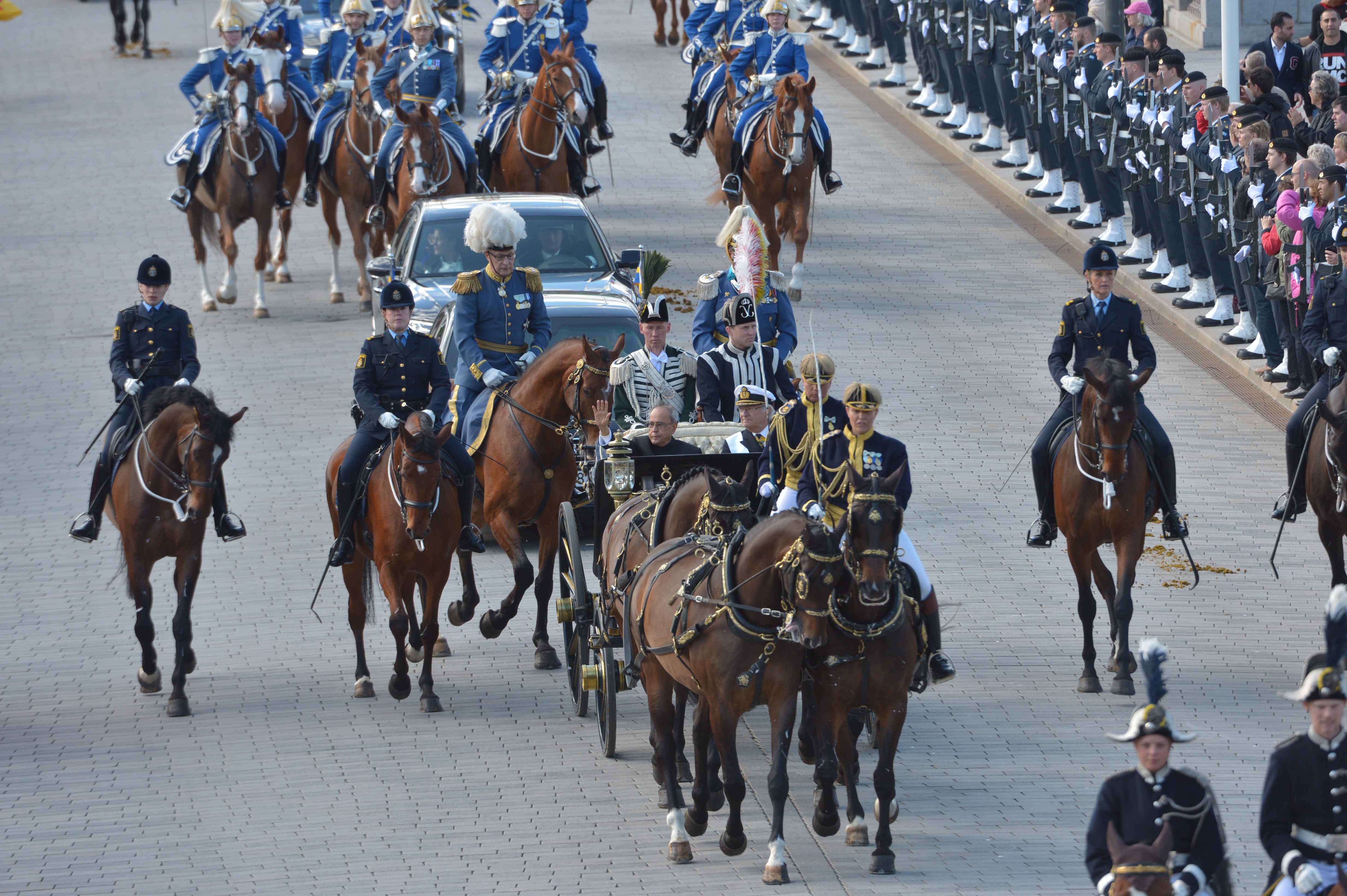 The President of India, Shri Pranab Mukherjee proceeding to Inner Courtyard of the Royal Palace by Royal Horse-driven Coach during his state visit of Sweden in Stockholm on May 31, 2015.