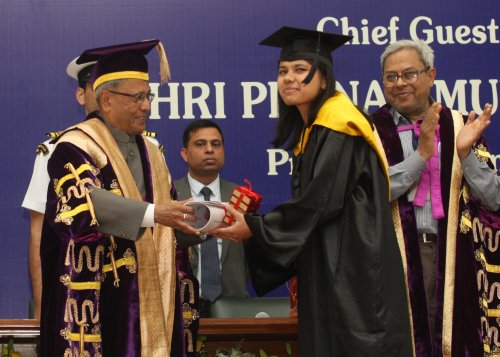 The President of India, Shri Pranab Mukherjee while presenting a degree to the student at the 90th Annual Convocation of University of Delhi at Vice Regal Lodge, University of Delhi in New Delhi on March 19, 2013.