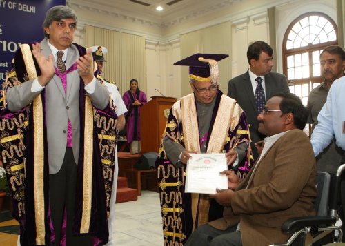 The President of India, Shri Pranab Mukherjee while presenting a degree to the student at the 90th Annual Convocation of University of Delhi at Vice Regal Lodge, University of Delhi in New Delhi on March 19, 2013. Also seen is the Vice Chancellor of the U