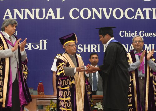 The President of India, Shri Pranab Mukherjee while presenting a degree to the student at the 90th Annual Convocation of University of Delhi at Vice Regal Lodge, University of Delhi in New Delhi on March 19, 2013. Also seen is the Vice Chancellor of the U