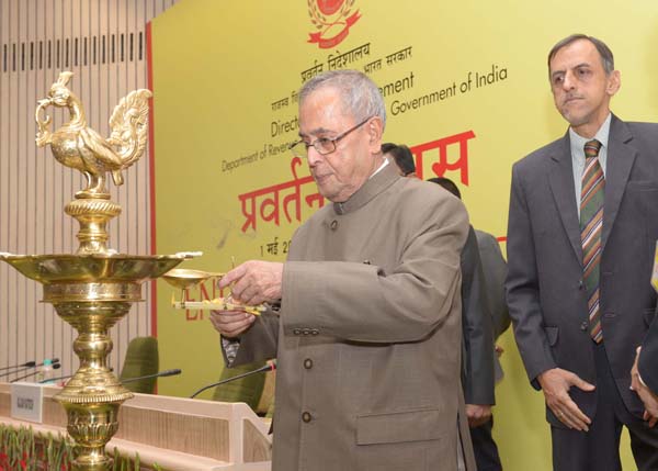 The President of India, Shri Pranab Mukherjee lighting the lamp at the 'Enforcement Day' function being organized on the occasion of Foundation Day of the Enforcement Directorate at Vigyan Bhavan in New Delhi on May 1, 2014. 