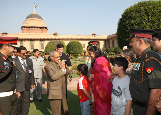 The President of India, Shri Pranab Mukherjee meeting with the Officers, JCOs, Other Ranks and Retired Personnel of the President’s Body Guards(PBG) with their family members at the 'At Home' Reception on the lawns of the Mughal Gardens at Rashtrapati Bha