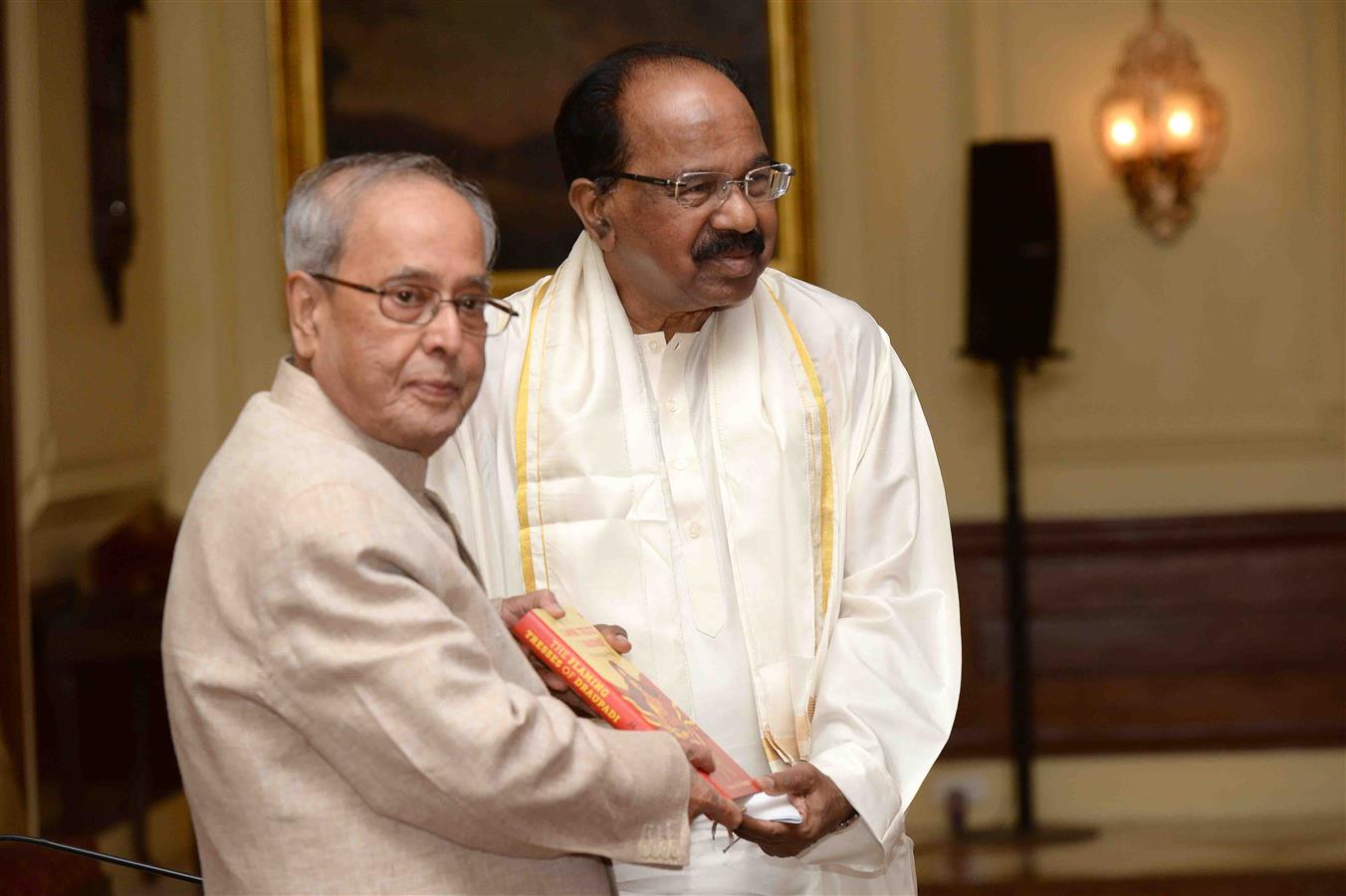 The President of India, Shri Pranab Mukherjee receiving the first copy of the book 'Flaming Tresses of Draupadi', the English version of Dr. M. Veerappa Moily's Epic Poem 'Sirimudi Parikramana' at Rashtrapati Bhavan on April 7, 2017.