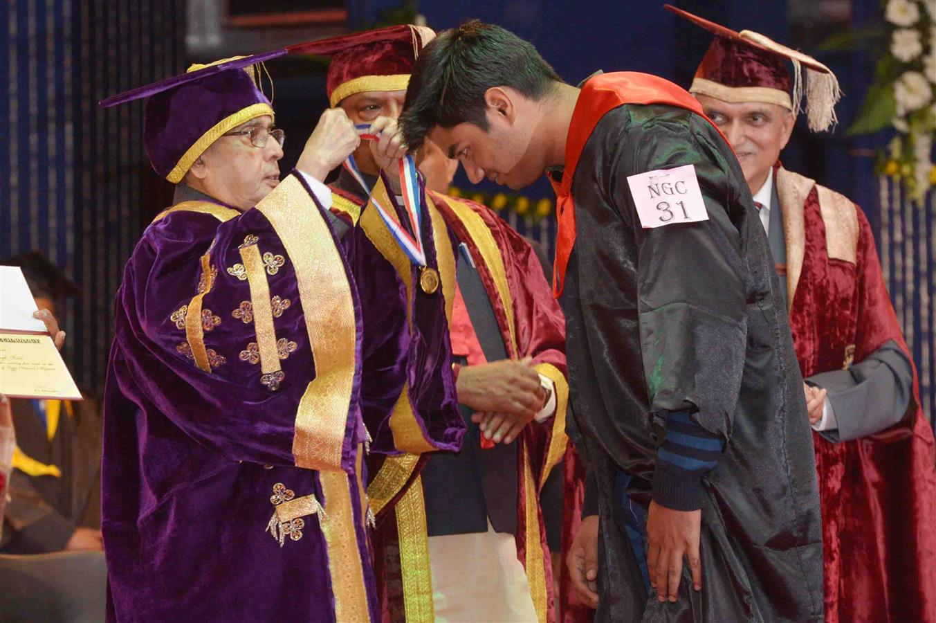 The President of India, Shri Pranab Mukherjee presenting the degree to a Student at the Diamond Jubilee Celebration and Convocation of Birla Institute of Technology at Ranchi in Jharkhand January 10, 2016. 