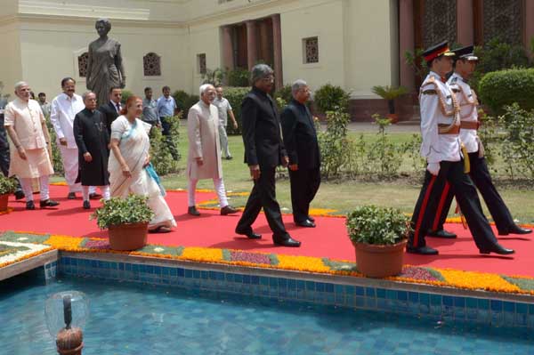 The President of India, Shri Pranab Mukherjee being conducted to the Central Hall of Parliament in a procession, before delivering his address to Parliament on June 09, 2014. Also seen are the Vice-President of India, Shri Mohammad Hamid Ansari, the Speak 