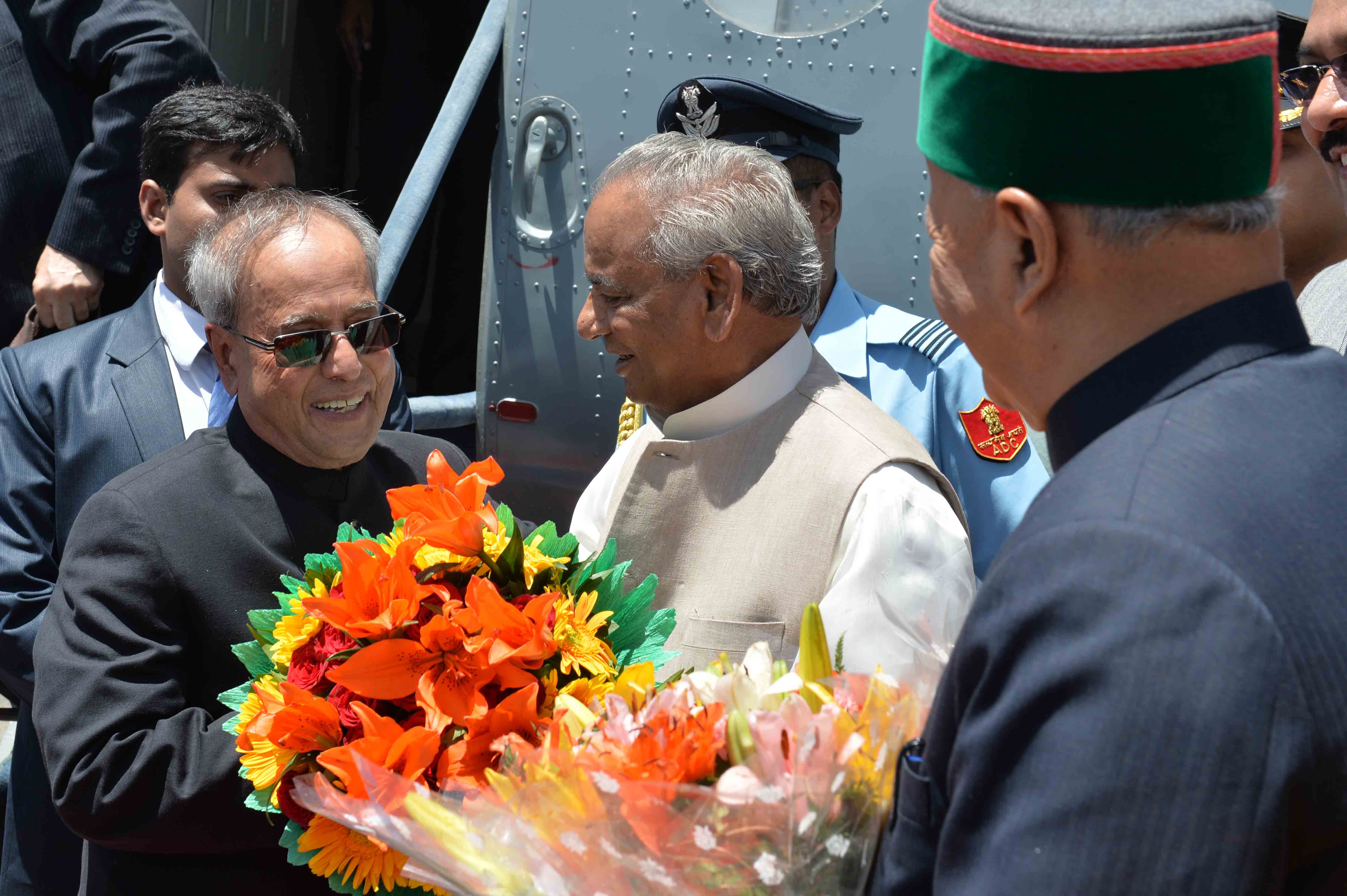 The President of India, Shri Pranab Mukherjee being received by the Governor and Chief Minister of Himachal Pradesh during his arrival at Shimla on June 11, 2015.