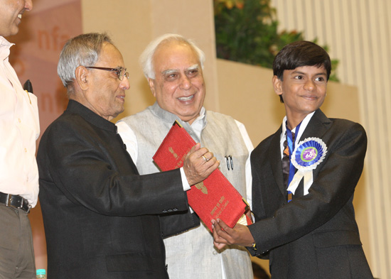 The President of India, Shri Pranab Mukherjee while presenting the Best Child Artiste Award at the 60th National Film Awards Function at Vigyan Bhavan in New Delhi on May 3, 2013. Also seen is the Union Minister of Communication and Information Technology