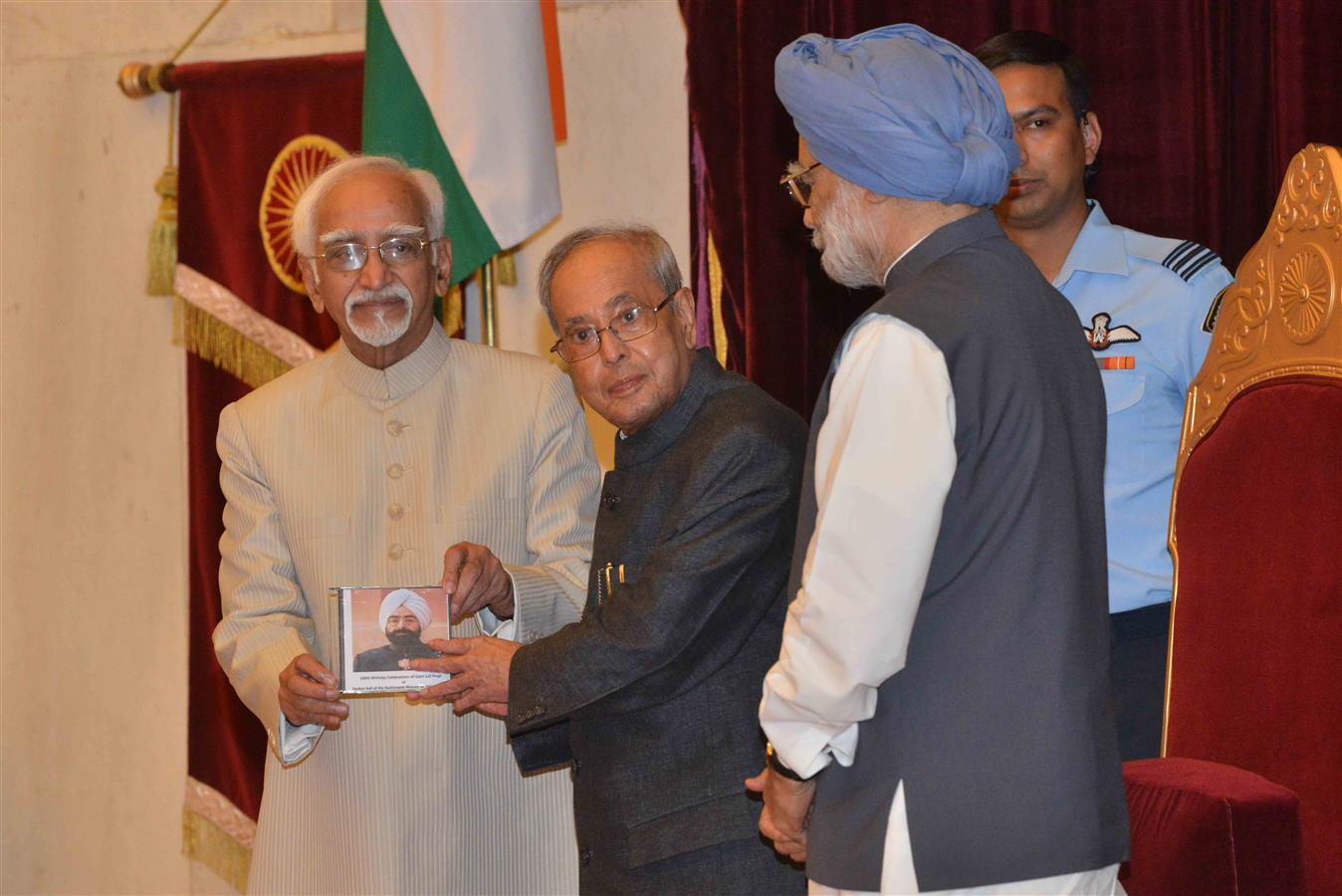 The Vice President of India, Shri M. Hamid Ansari releasing the documentary on the life of the Former President of India, Late Shri Giani Zail Singh and first copy presenting to the President of India, Shri Pranab Mukherjee on the occasion of 100th Birth 