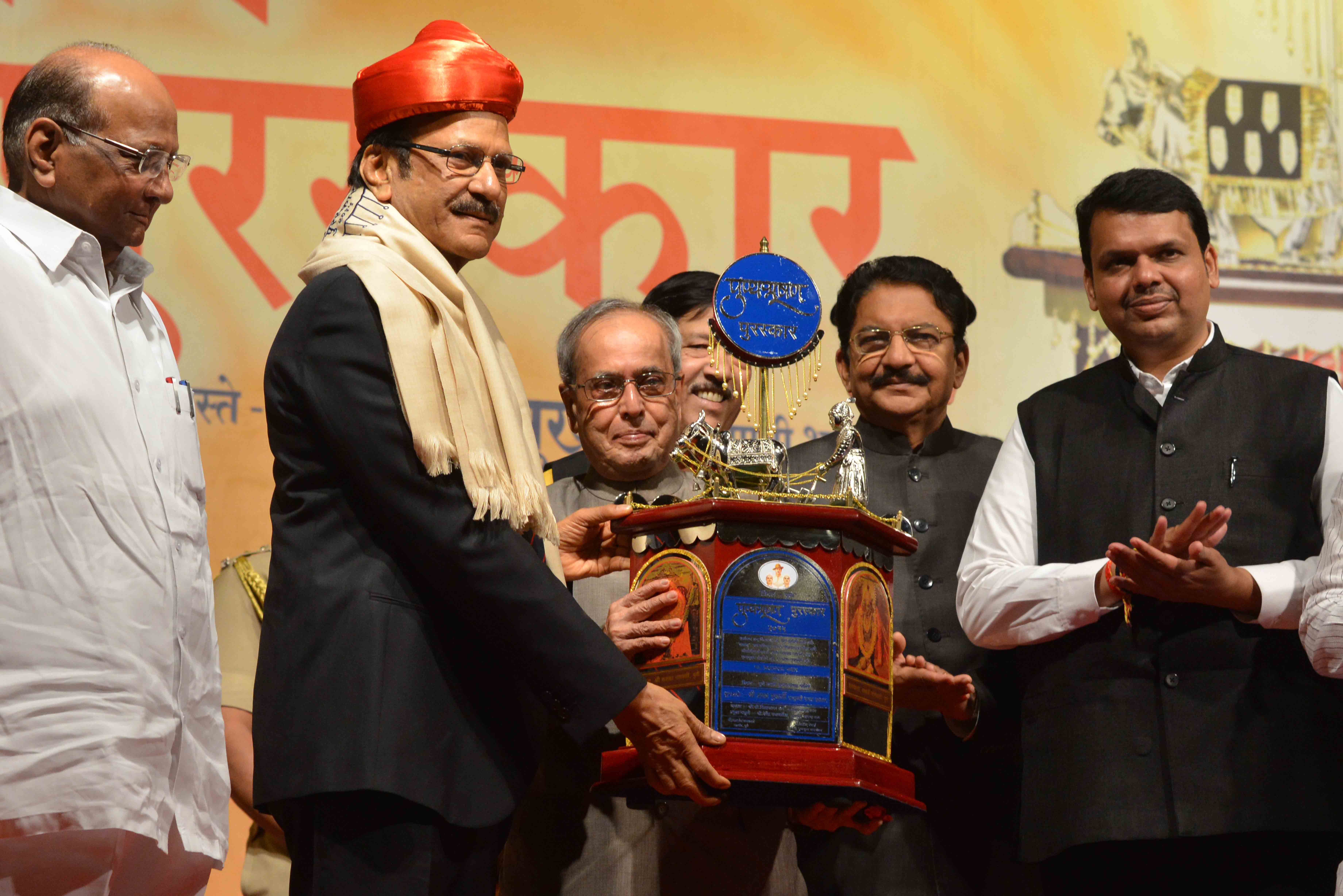 The President of India, Shri Pranab Mukherjee, at presentation of the Punyabhushan Award to Shri Prataprao Pawar and felicitation to Freedom Fighters at Pune on June 26, 2015