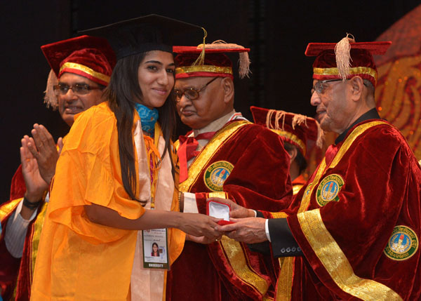 The President of India, Shri Pranab Mukherjee while presenting a degree to the student at the Convocation Ceremony of Devi Ahilya Vishwavidayalaya at Indore in Madhya Pradesh on June 28, 2014. Also seen are the Governor of Madhya Pradesh, Shri Ram Naresh 