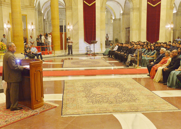 The President of India, Shri Pranab Mukherjee interacting with the Officer Trainees of 67th Batch of Indian Revenue Service from National Academy of Direct Taxes, Nagpur at the Darbar Hall of Rashtrapati Bhavan in New Delhi on July 16, 2014. 