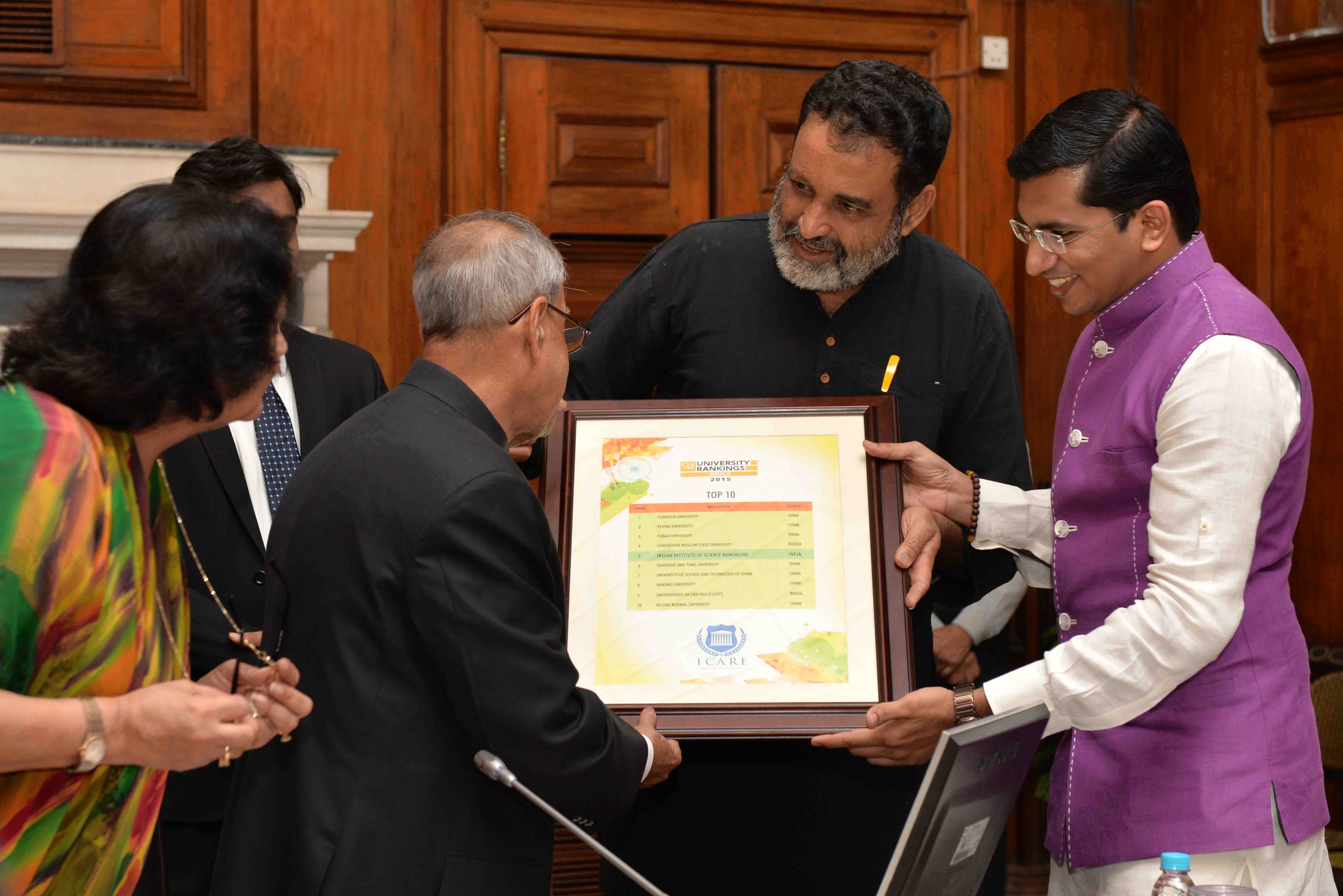 The President of India, Shri Pranab Mukherjee receiving the first copy of “QS BRICS Universities Ranking 2015” from Shri TV Mohandas Pai, Chairman, Indian Centre for Academic Rankings and Excellence (ICARE) with others at Rashtrapati Bhavan on July 11, 20