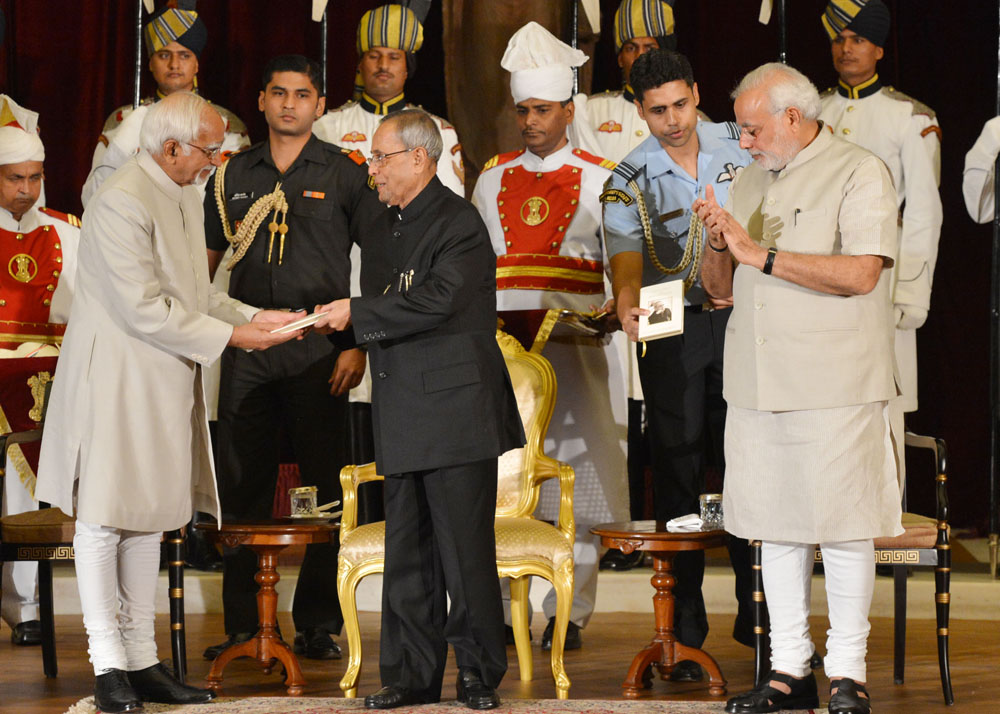 The President of India, Shri Pranab Mukherjee receiving first copy of the ‘Thoughts and Reflections’-a compilation of Quotes of the President from the Vice President of India, Shri Hamid Ansari at Rashtrapati Bhavan in New Delhi on July 25, 2014. Also see 