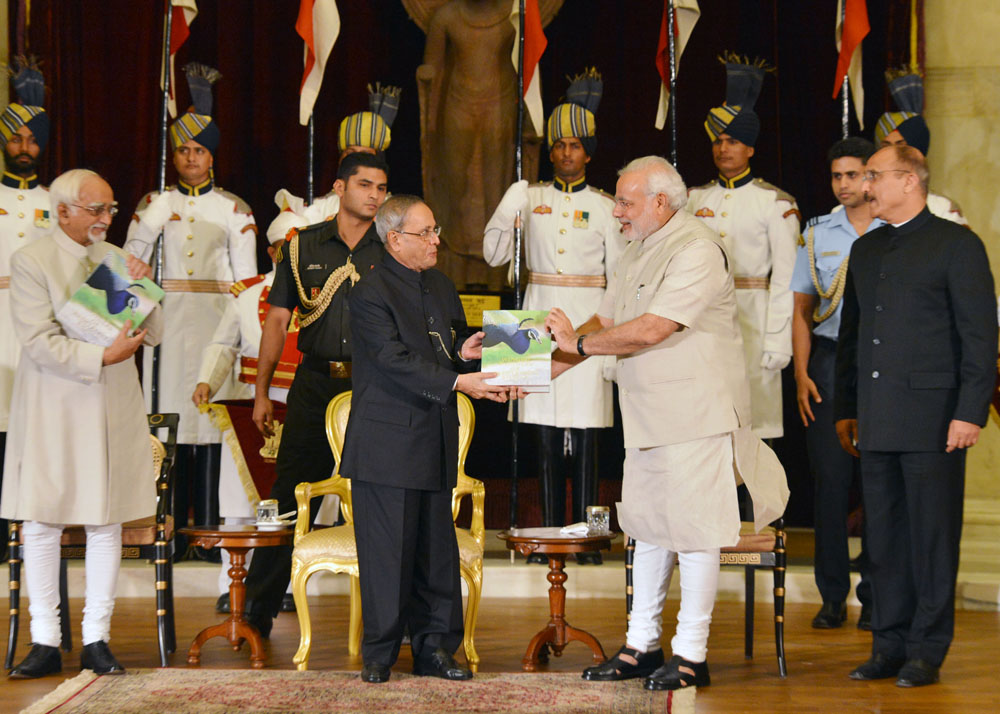 The President of India, Shri Pranab Mukherjee receiving first copy of the ‘Winged Wonders of Rashtrapati Bhavan’ from the Prime Minister of India, Shri Narendra Modi at Rashtrapati Bhavan in New Delhi on July 25, 2014. ‘Winged Wonders of Rashtrapati Bhav 