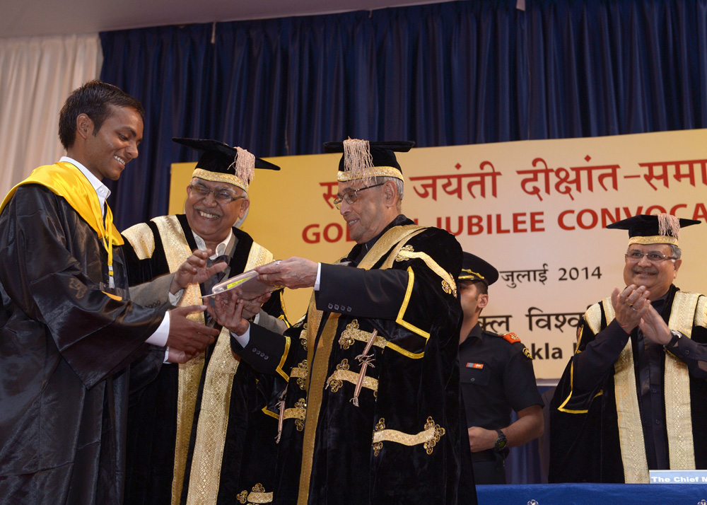 The President of India, Shri Pranab Mukherjee while presenting a degree to the student at the Golden Jubilee Convocation of Pt. Ravishankar Shukla University at Raipur in Chhattisgarh on July 26, 2014. 