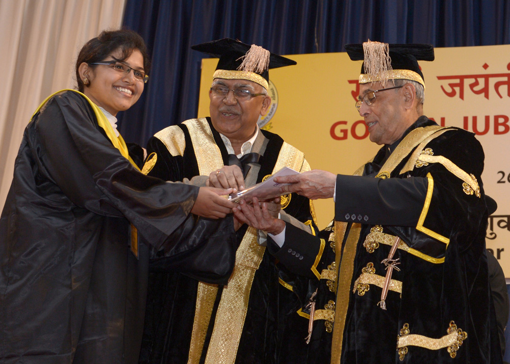 The President of India, Shri Pranab Mukherjee while presenting a degree to the student at the Golden Jubilee Convocation of Pt. Ravishankar Shukla University at Raipur in Chhattisgarh on July 26, 2014. 