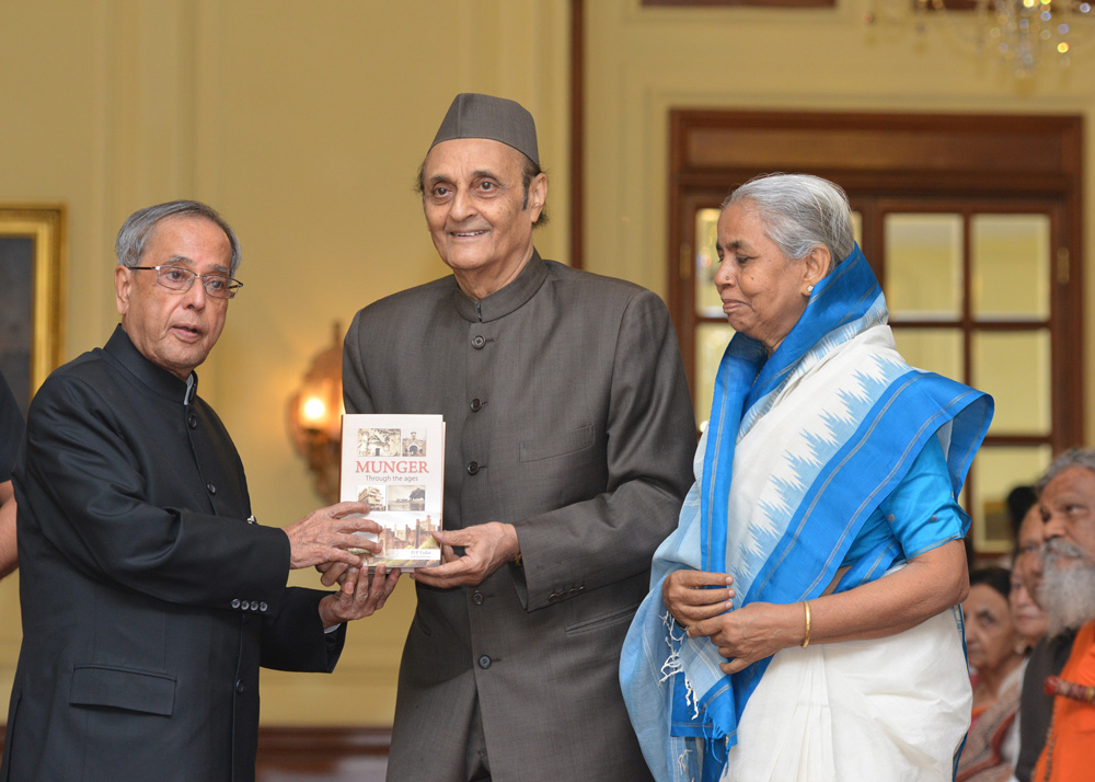 The President of India, Shri Pranab Mukherjee receiving the first copy of a book 'Munger Through the Ages' written by Late Shri D.P. Yadav at Rashtrapati Bhavan on August 7, 2014. 