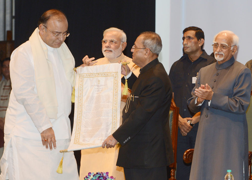 The President of India, Shri Pranab Mukherjee presenting Outstanding Parliamentarian Award for 2010 to Shri Arun Jaitley at Balyogi Auditorium, Parliament Library Building in New Delhi on August 12, 2014. 