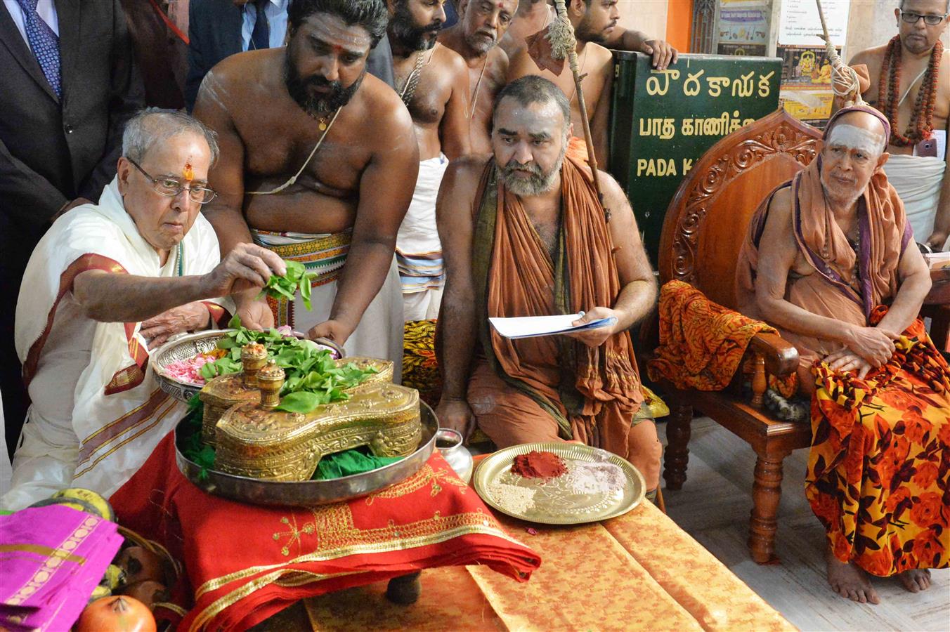 The President of India, Shri Pranab Mukherjee performing the Pada Puja to the Divine Padukas of Sri Adi Shankaracharya with Golden Bilvams during the visit at Sankara Mutt at Kancheepuram in Tamil Nadu on June 13, 2017.