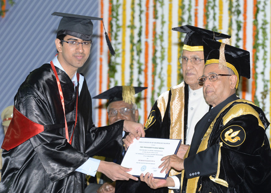 The President of India, Shri Pranab Mukherjee while presenting a degree to the student at the 45th Annual Convocation of IIT Kanpur in Uttar Pradesh on July 5, 2013. Also seen is the Governor of Uttar Pradesh, Shri B. L. Joshi.