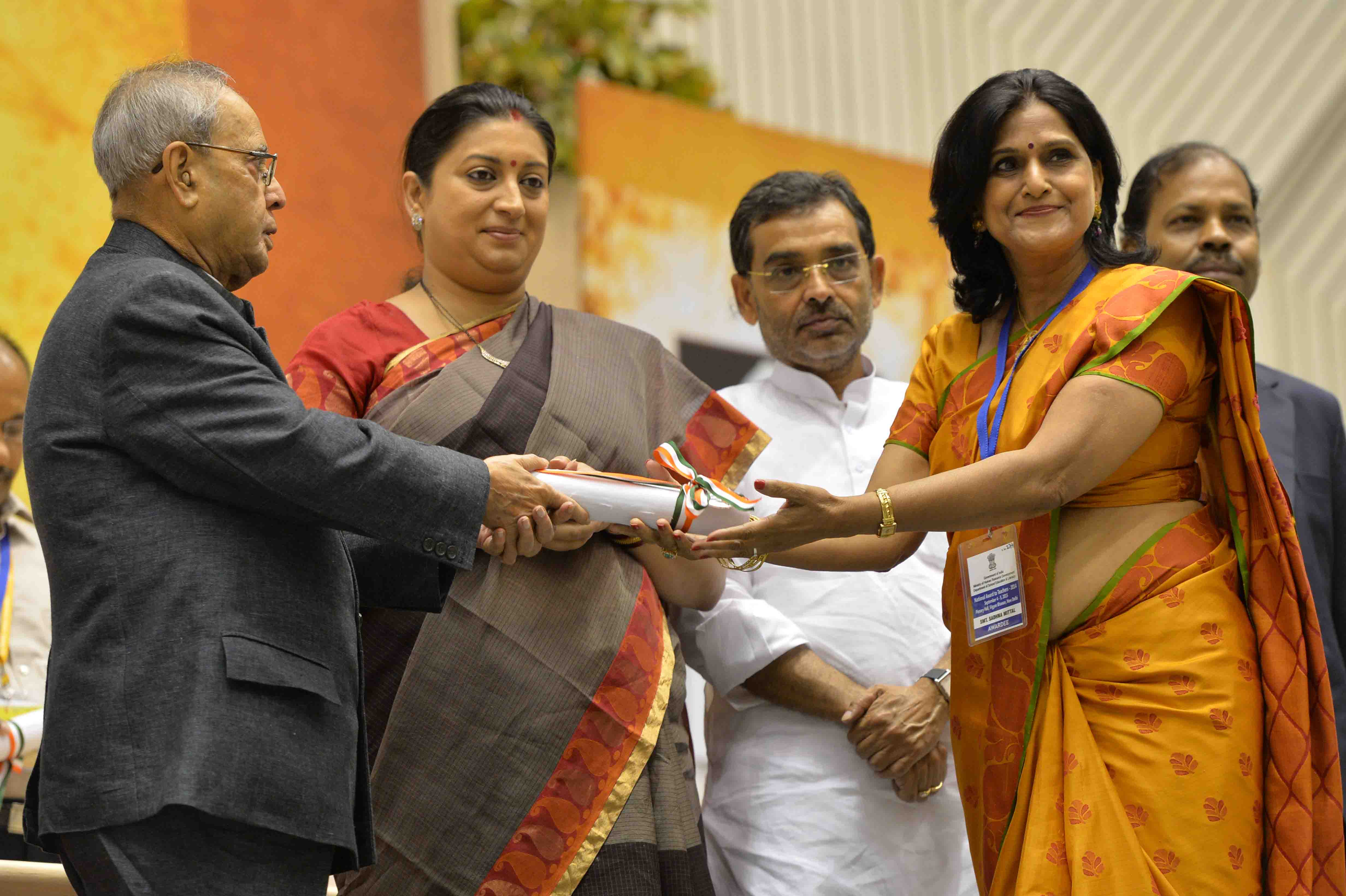 The President of India, Shri Pranab Mukherjee presenting a National Award to teacher on the occasion of Teachers’ Day at Vigyan Bhavan in New Delhi on September 5, 2015.