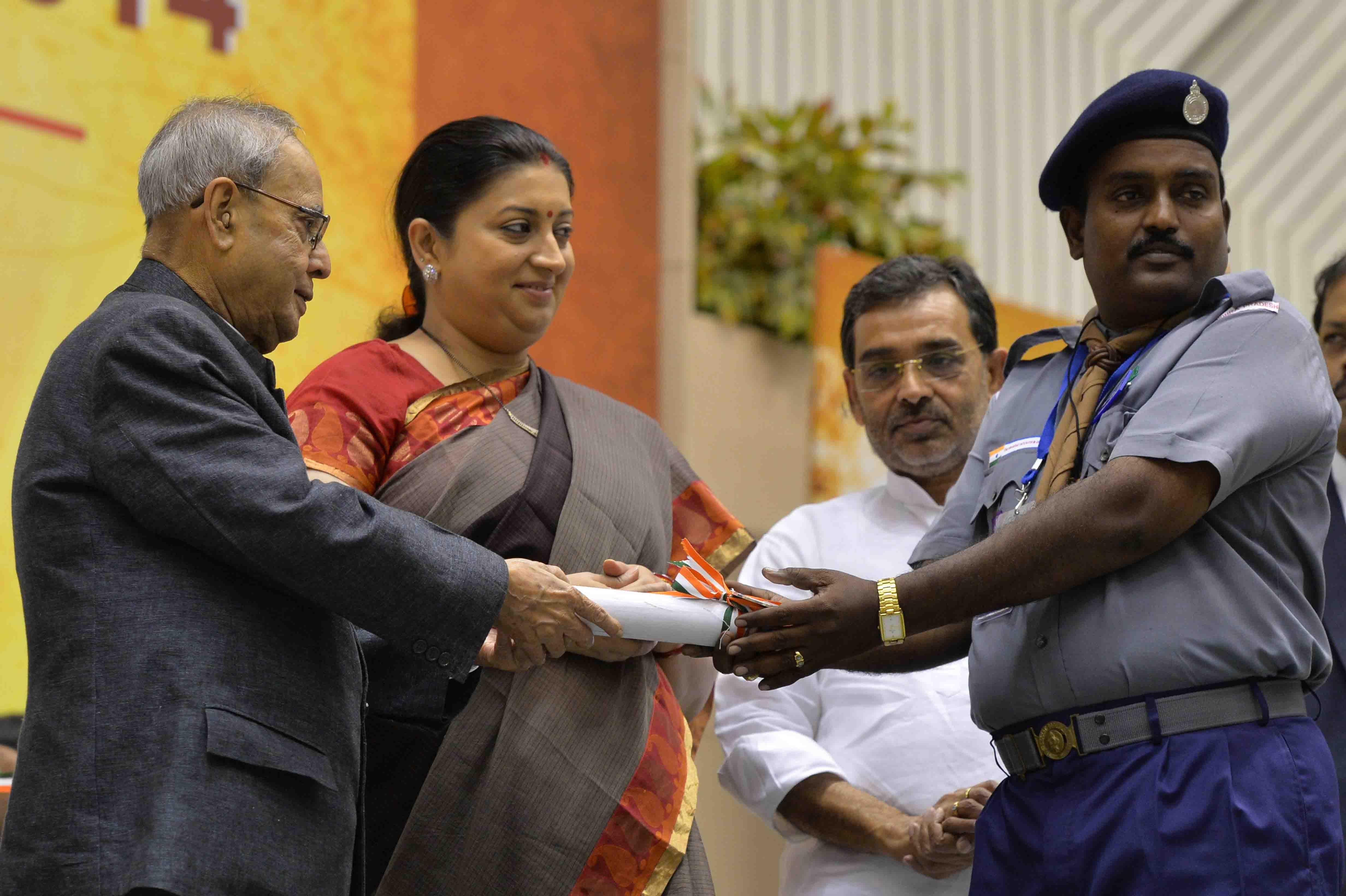 The President of India, Shri Pranab Mukherjee presenting a National Award to teacher on the occasion of Teachers’ Day at Vigyan Bhavan in New Delhi on September 5, 2015.