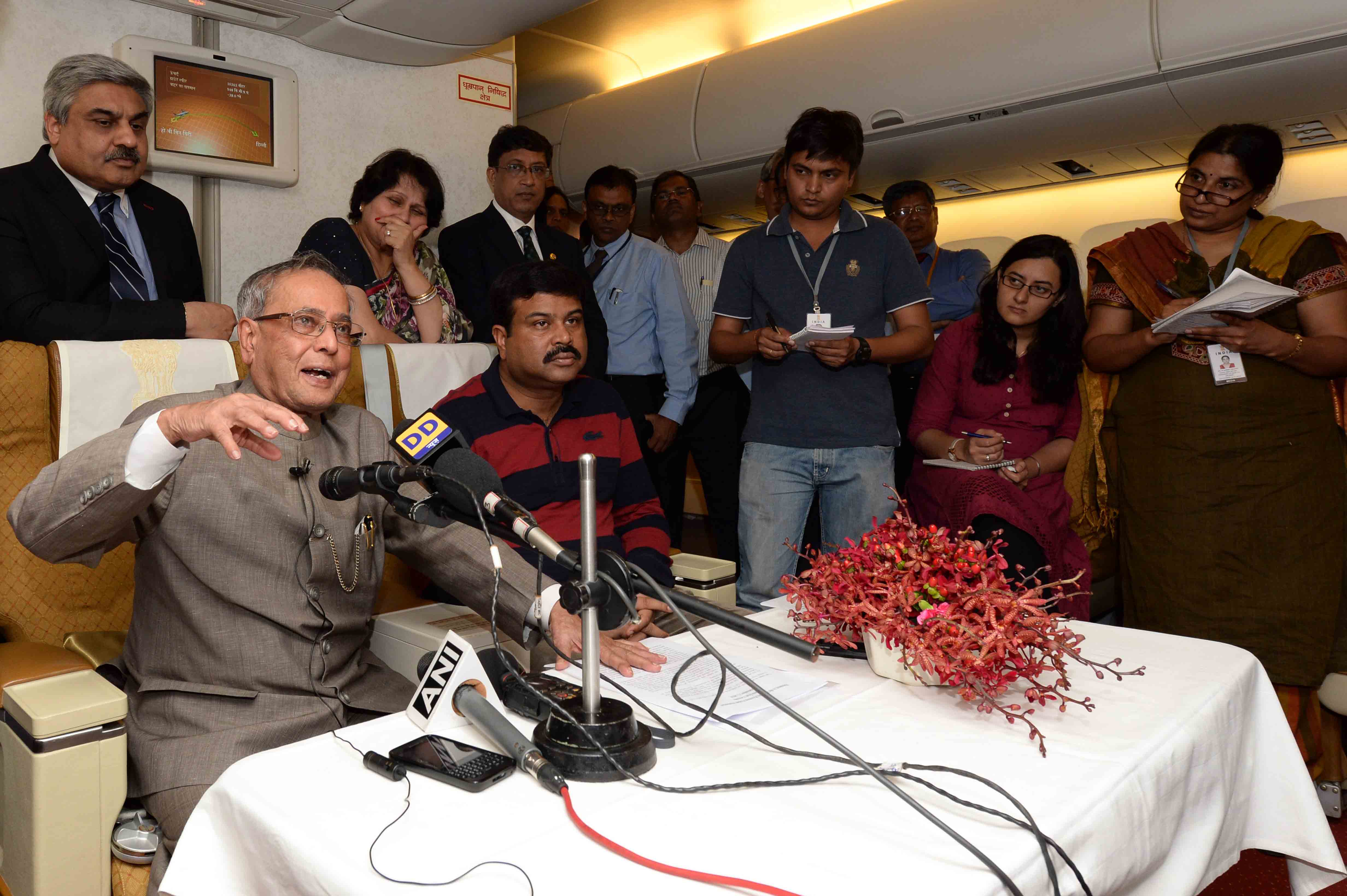 The President of India, Shri Pranab Mukherjee interacting with his accompanying media delegation his way back to India from Ho Chi Minh City on September 17, 2014. 