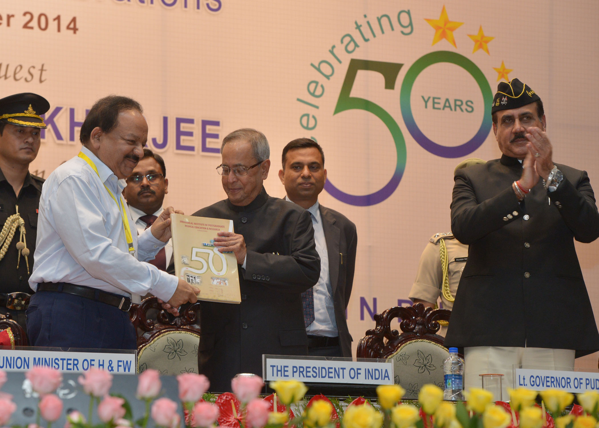 The President of India, Shri Pranab Mukhrjee receiving the first copy of the Golden Jubilee Souvenir from the Union Minister of Health and Family Welfare, Dr. Harsh Vardhan at the Golden Jubilee Celebration of Jawaharlal Institute of Postgraduate Medical 