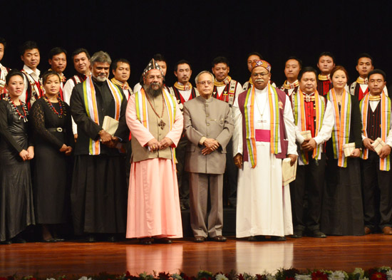 Santa Claus greets the President of India, Shri Pranab Mukherjee after performing the 'Ao Naga Choir' program at Rashtrapati Bhavan Auditorium in New Delhi on December 15, 2012.