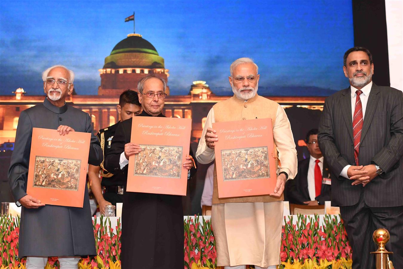 The President of India, Shri Pranab Mukherjee, the Vice President of India, Shri M. Hamid Ansari, and the Prime Minister of India, Shri Narendra Modi releasing the three Folios entitled i) "Select Paintings of Rashtrapati Bhavan" ii) "Paintings in the Ash 