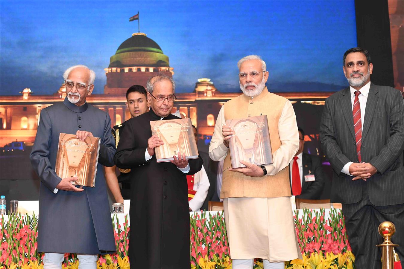 The Prime Minister of India, Shri Narendra Modi releasing the book titled "A Work of Beauty : The Architecture and Landscape of Rashtrapati Bhavan" and first copy presented to the President of India, Shri Pranab Mukherjee at Rashtrapati Bhavan on July 25, 