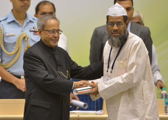 The President of India, Shri Pranab Mukherjee while presenting a National Award for the year 2012 on the occasion of Teachers’ Day at Vigyan Bhavan in New Delhi on September 5, 2013.