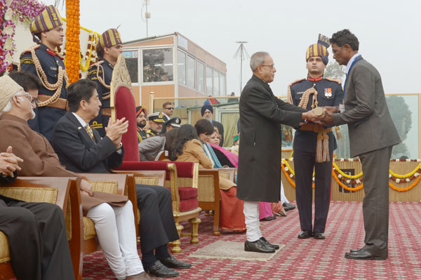 The President of India, Shri Pranab Mukherjee conferring the Ashok Chakra (India's highest gallantry award in peacetime) posthumously on Sub-Inspector K Prasad Babu of Andhra Pradesh's counter-Maoist force at the Republic Day Parade in New Delhi on Janu 