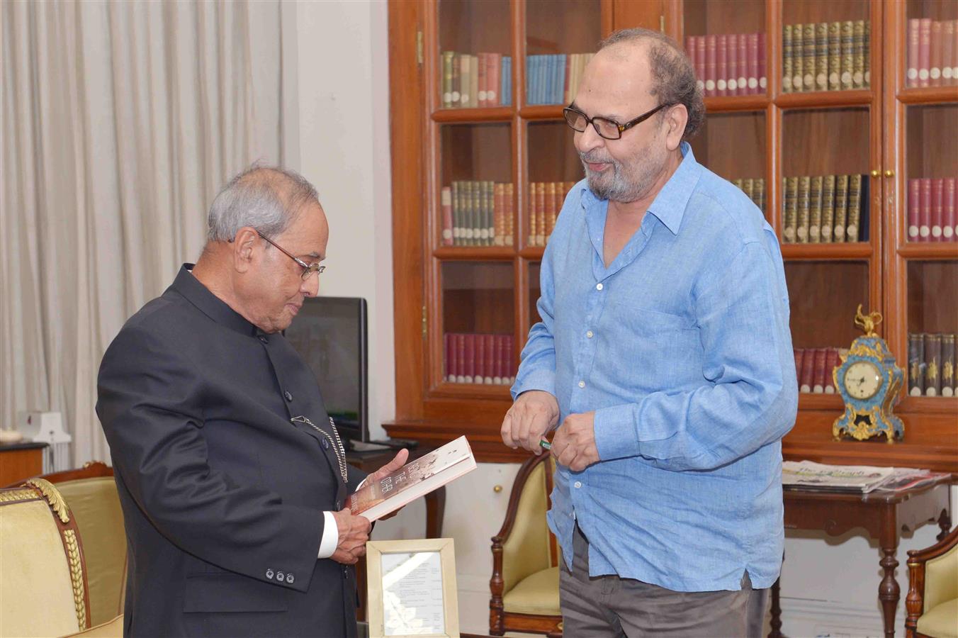 Shri Saeed Naqvi presenting a copy of his book ' Being the Other : The Muslim in India' to the President of India, Shri Pranab Mukherjee at Rashtrapati Bhavan on August 6, 2016. 