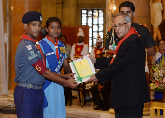 The President of India, Shri Pranab Mukherjee while presenting a Rashtrapati Scouts Award for the year 2010 and 2011 to the scouts at the Durbar Hall of Rashtrapati Bhavan in New Delhi on September 9, 2013.