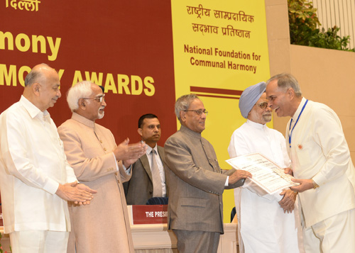 The President of India, Shri Pranab Mukherjee while presenting a National Communal Harmony Award for the year 2011 and 2012 at Vigyan Bhavan in New Delhi on September 20, 2013. The Vice-President of India, Shri M. Hamid Ansari and the Prime Minister of I