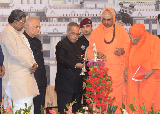 The President of India, Shri Pranab Mukherjee lighting the lamp at the inauguration of the new hospital building of Jagadguru Sri Shiva-rathreeshwara (JSS) Maha-vidya-peetha at Mysore in Karnataka on September 23, 2013. Also seen are the Governor of Karna