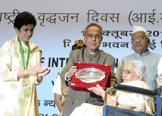 The President of India, Shri Pranab Mukherjee while presenting a National Awards for Senior Citizens - Vayoshreshtha Samman on the occasion of International Day Older Persons at Vigyan Bhavan in New Delhi on October 1, 2013. The Union Minister of Social J