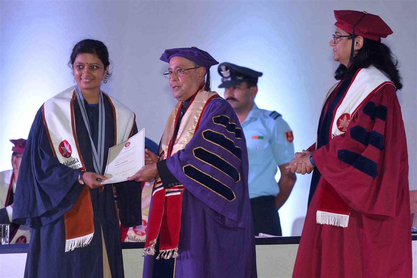 The President of India, Shri Pranab Mukherjee presenting the degree to a student at the first convocation of Nalanda University at Rajgir, Nalanda in Bihar on August 27, 2016. 